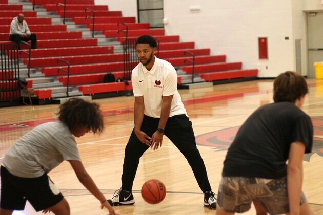 Union boy’s basketball coach William Wright runs a station at a recent clinic for middle school scholars