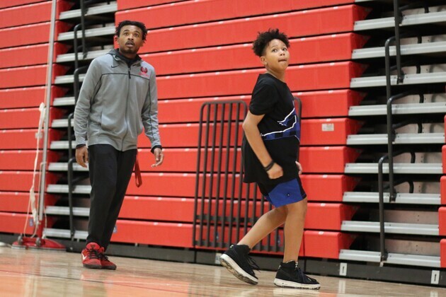 Union boy’s basketball junior varsity coach Ronnie Little watches a shot go up at a recent clinic for GRPS middle school scholars