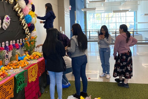 Construction of the altar at Southwest Middle High School - Academia Bilingüe for the Day of the Dead or Día de los Muertos.