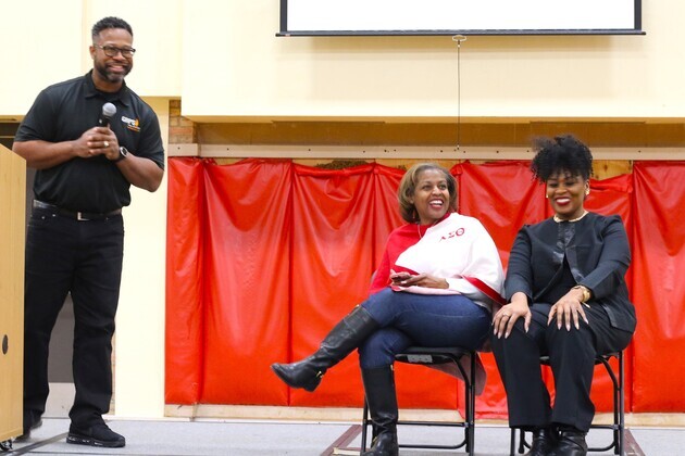Emmanuel Armstrong, Leadriane Roby and Brandy Lovelady Mitchell (from left to right) appreciate district seniors “making some noise” as their high school is called at the Senior Summit
