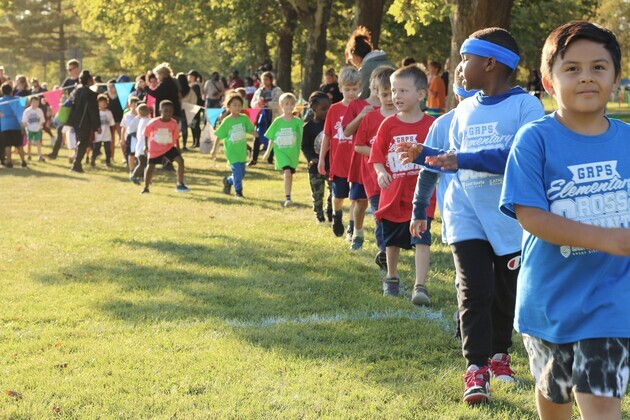 The young runners head to the starting line