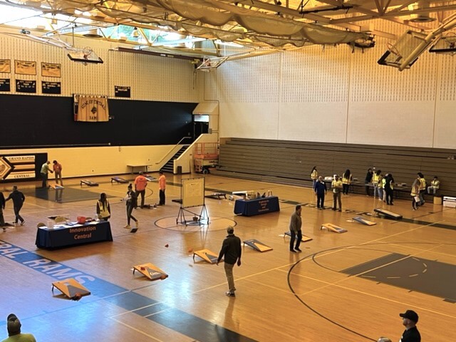 The gym at Innovation Central was turned into the hub of a fundraising cornhole tournament to benefit the Academy of Design and Construction at the high school