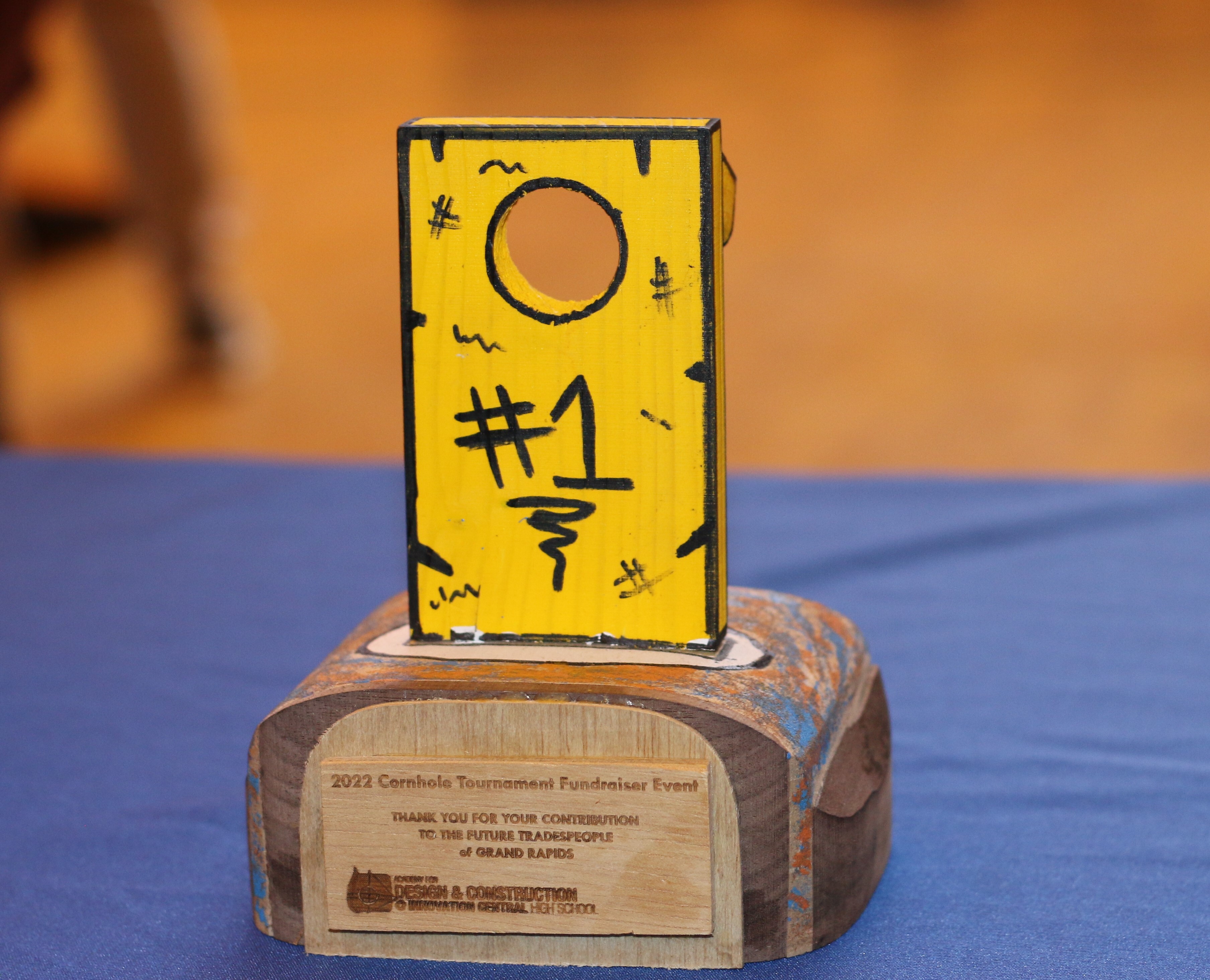 All of the trophies in the cornhole tournament were created by students in the Academy of Design and Construction