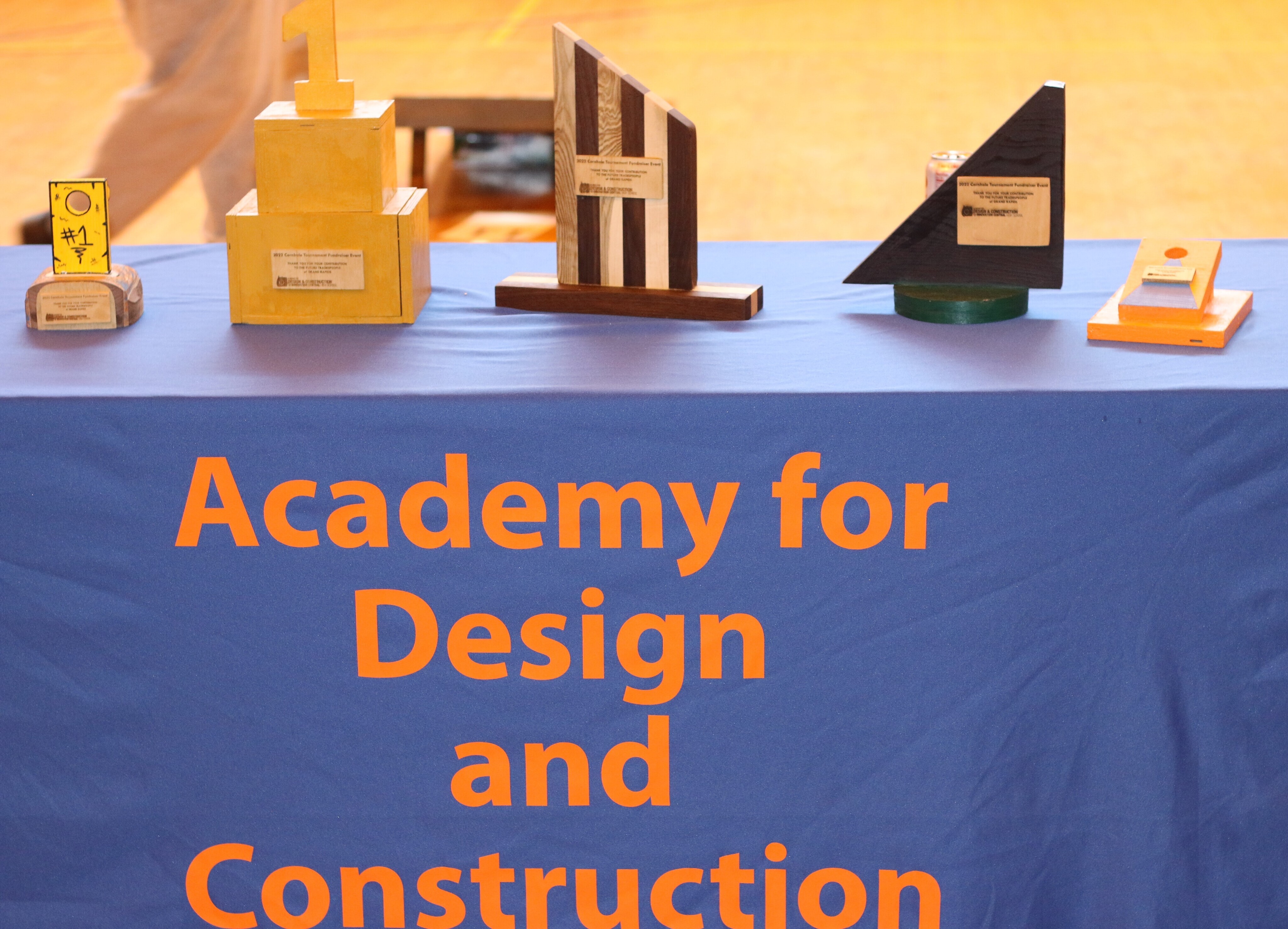 All of the trophies in the cornhole tournament were created by students in the Academy of Design and Construction