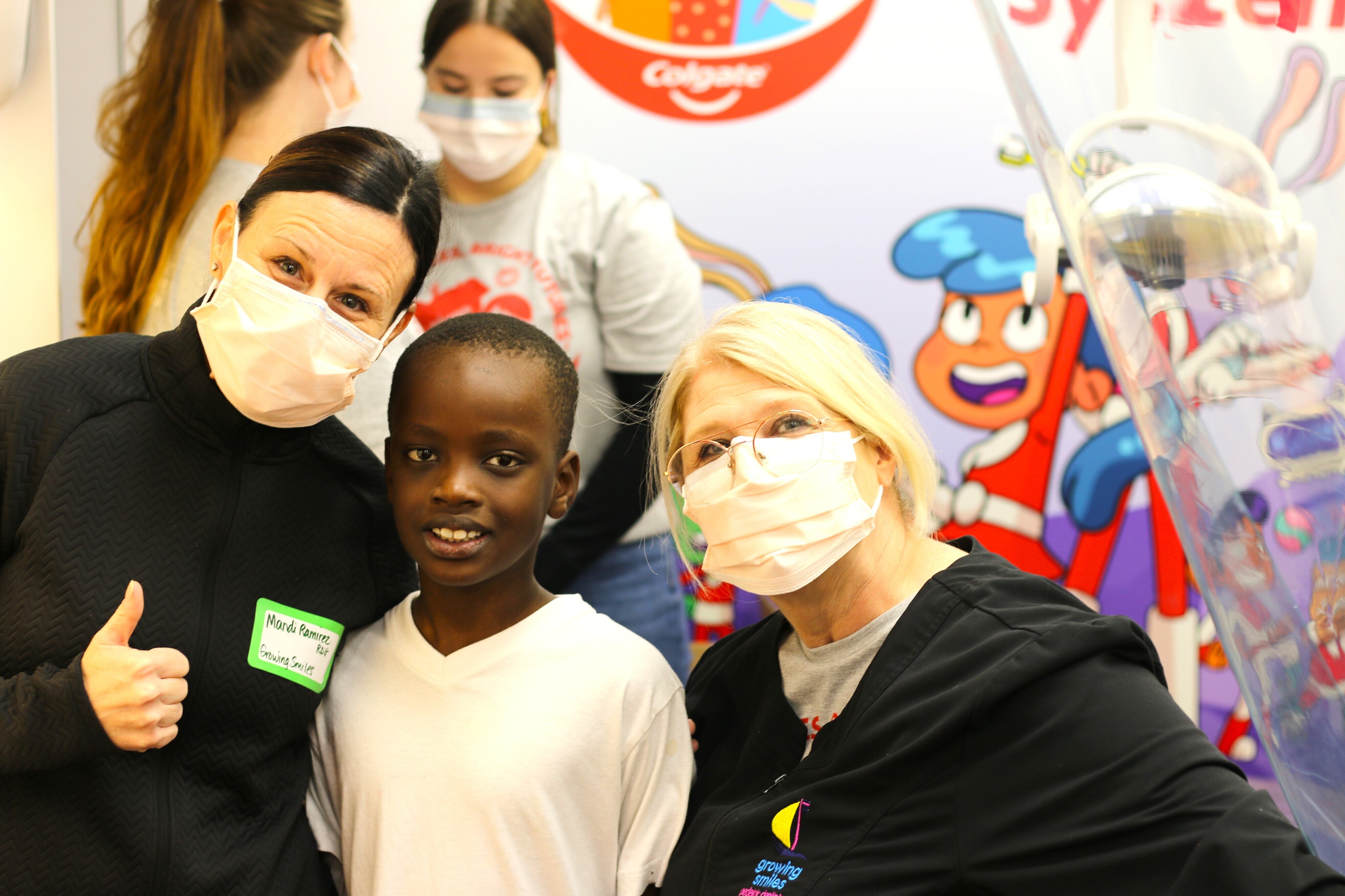 Volunteers from Growing Smiles Pediatric Dentistry with a GRPS student