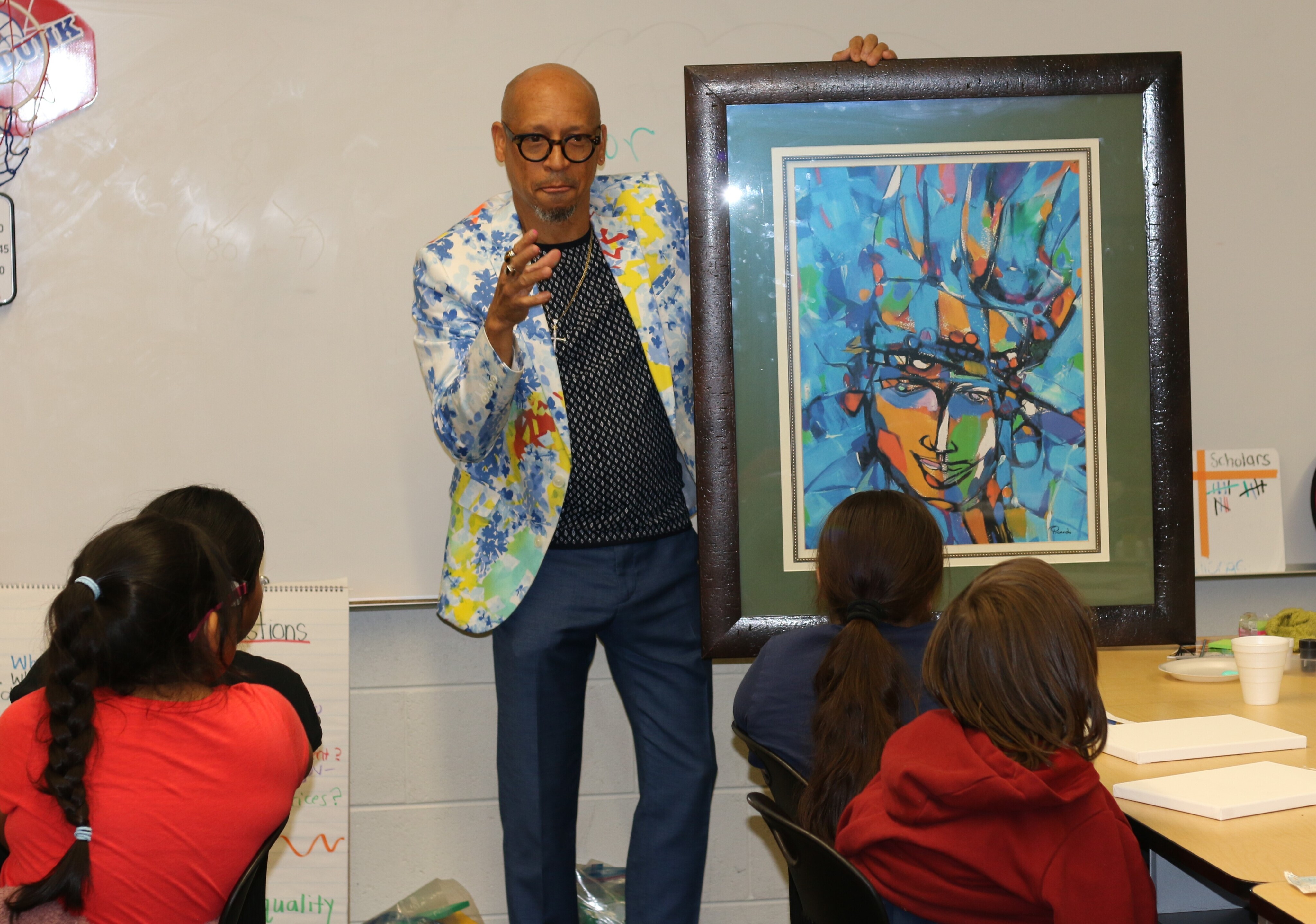Local artist Erick Picardo visited numerous GRPS schools, including César E. Chávez Elementary, as part of Hispanic Heritage Month and brought along some of his own work to inspire the scholars