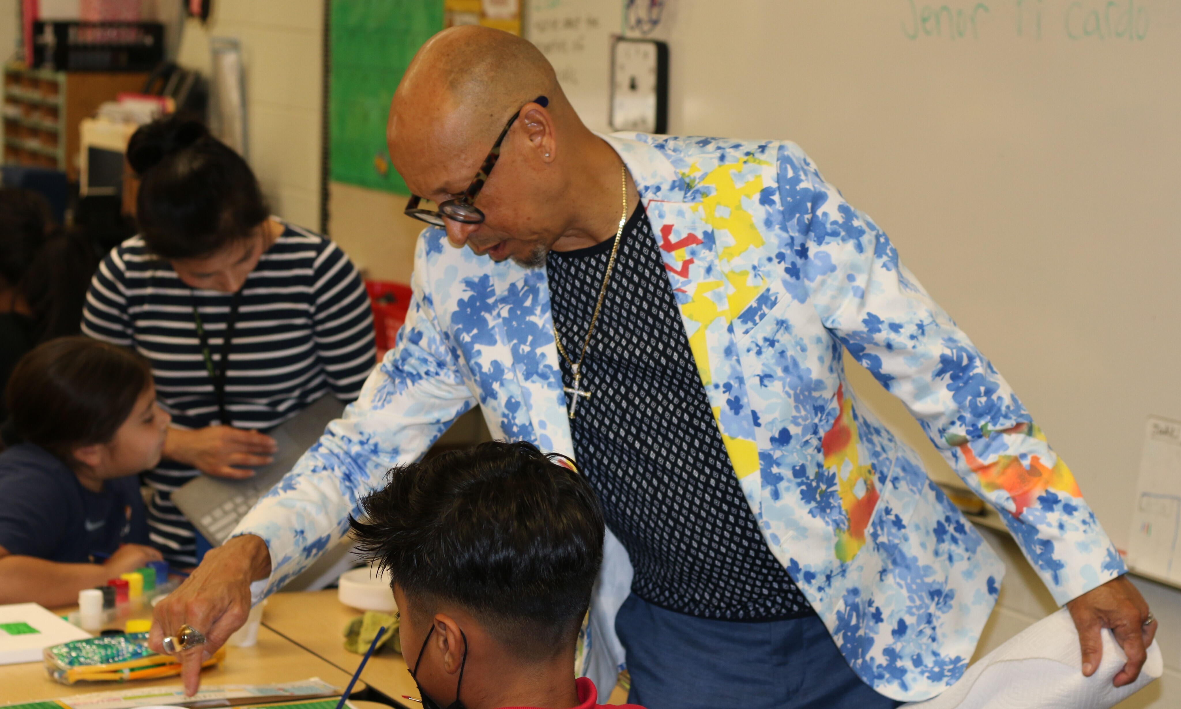 Erick Picardo was busy visiting students and giving advice as they worked on their art projects at César E. Chávez Elementary